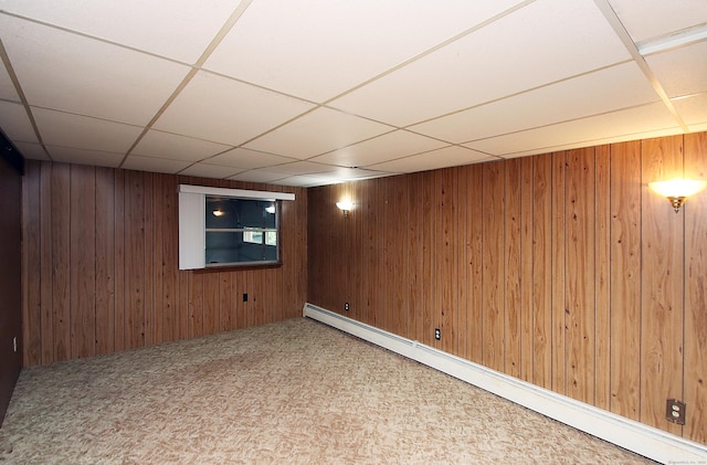 179 N Moodus Rd, East Haddam, CT 06469 - finished basement featuring a baseboard heating unit, a paneled ceiling, and wooden walls