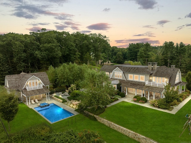 294 Maple Rd, Easton, CT 06612 - back of property with a balcony, a lawn, an outdoor pool, and a patio