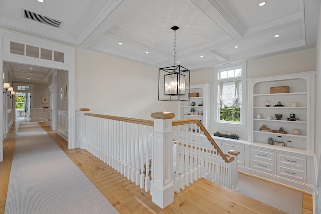 294 Maple Rd, Easton, CT 06612 - hallway with an upstairs landing, coffered ceiling, light wood-style flooring, beamed ceiling, and a decorative wall