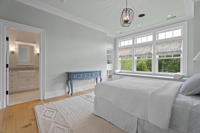 294 Maple Rd, Easton, CT 06612 - bedroom featuring crown molding, a sink, light wood-style floors, baseboards, and connected bathroom