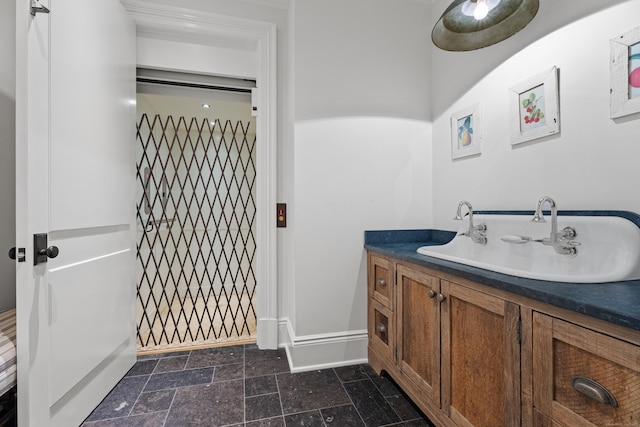 294 Maple Rd, Easton, CT 06612 - bathroom with baseboards, stone tile floors, and vanity