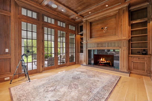 294 Maple Rd, Easton, CT 06612 - unfurnished living room with wooden ceiling with exposed beams, built in shelves, french doors, wood finished floors, and coffered ceiling