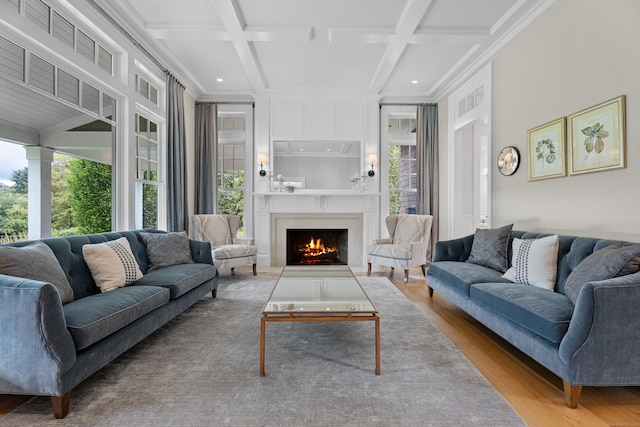 294 Maple Rd, Easton, CT 06612 - living area with coffered ceiling, healthy amount of natural light, wood finished floors, a fireplace, and crown molding