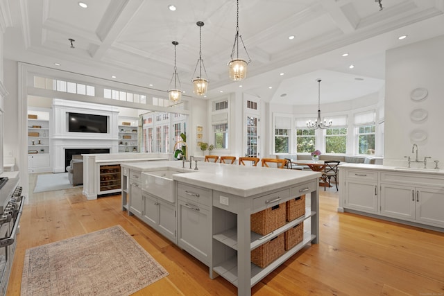 294 Maple Rd, Easton, CT 06612 - kitchen featuring a sink, coffered ceiling, a chandelier, recessed lighting, and a fireplace