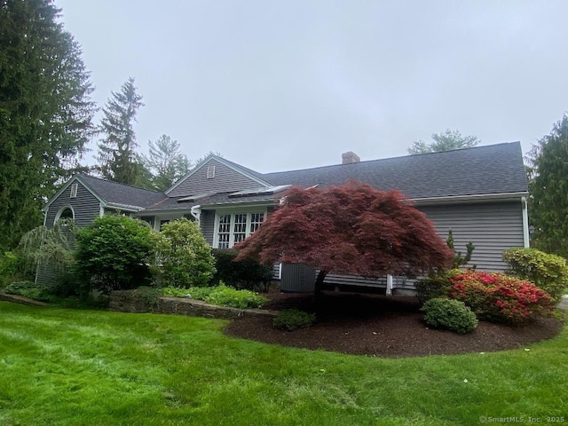 2 Tunxis Pl, Cheshire, CT 06410 - view of home's exterior with a yard, a chimney, and central AC unit