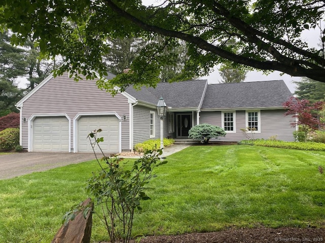 2 Tunxis Pl, Cheshire, CT 06410 - view of front of house with asphalt driveway, a garage, a front yard, and roof with shingles