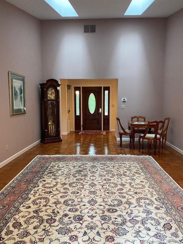 2 Tunxis Pl, Cheshire, CT 06410 - entryway with a skylight, a towering ceiling, and baseboards