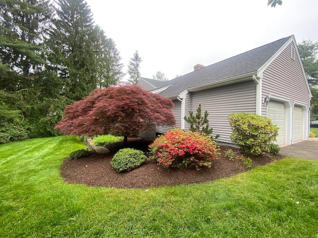2 Tunxis Pl, Cheshire, CT 06410 - view of side of home featuring a chimney, a lawn, an attached garage, driveway, and a shingled roof