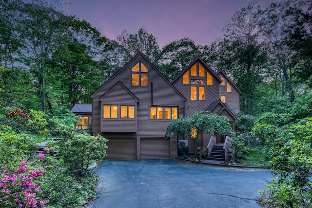 522 Peddlers Rd, Guilford, CT 06437 - view of front of house with asphalt driveway and a garage