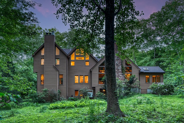 522 Peddlers Rd, Guilford, CT 06437 - back of property with a chimney and a lawn
