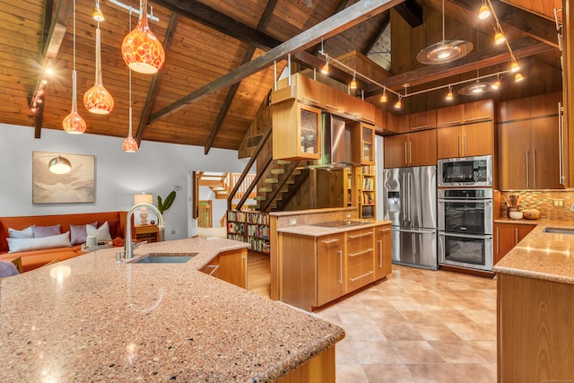 522 Peddlers Rd, Guilford, CT 06437 - kitchen with stainless steel appliances, brown cabinetry, a wood ceiling with exposed beams, tasteful backsplash, and light stone countertops