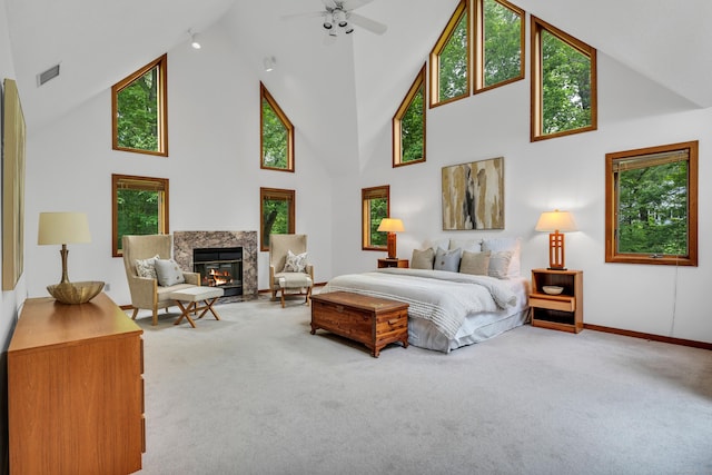 522 Peddlers Rd, Guilford, CT 06437 - carpeted bedroom with high vaulted ceiling, multiple windows, and a fireplace