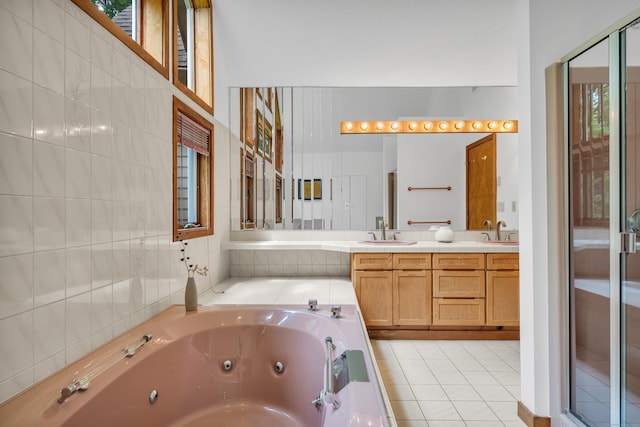 522 Peddlers Rd, Guilford, CT 06437 - full bath with a jetted tub, double vanity, and tile patterned flooring