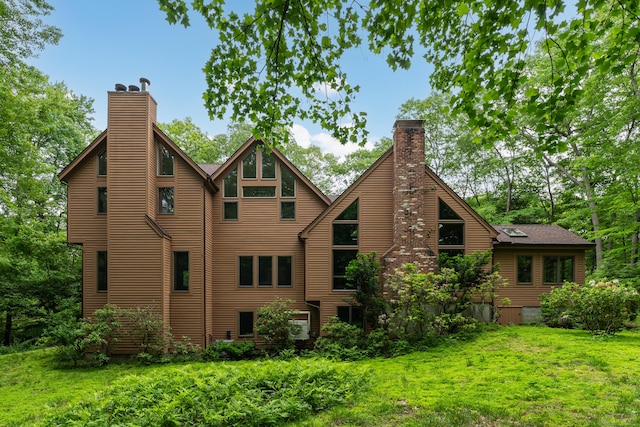 522 Peddlers Rd, Guilford, CT 06437 - rear view of property with a chimney and a lawn