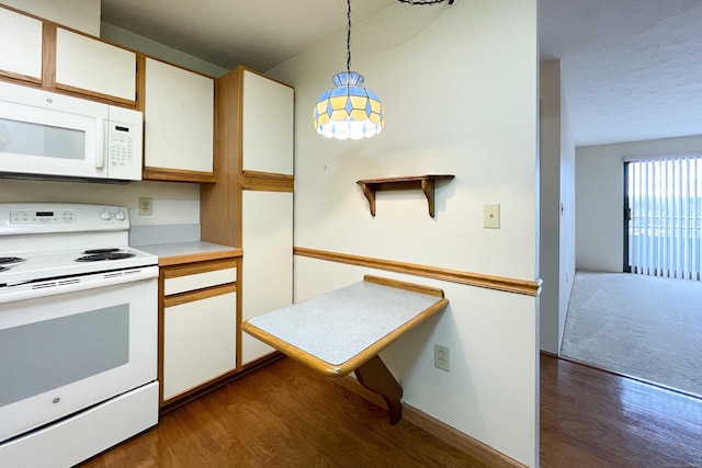 111 Dekoven Dr Apt 506, Middletown, CT 06457 - kitchen featuring white appliances, dark wood-type flooring, decorative light fixtures, white cabinetry, and light countertops