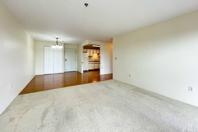 111 Dekoven Dr Apt 506, Middletown, CT 06457 - unfurnished room with carpet flooring and a chandelier