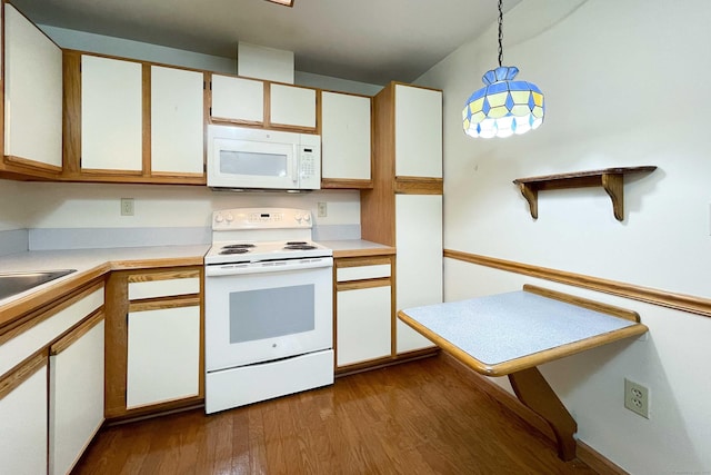 111 Dekoven Dr Apt 506, Middletown, CT 06457 - kitchen featuring white appliances, light countertops, pendant lighting, dark wood-style floors, and white cabinetry