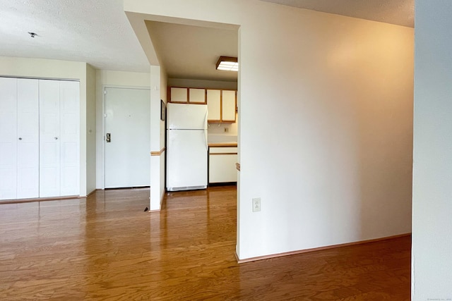 111 Dekoven Dr Apt 506, Middletown, CT 06457 - unfurnished living room featuring wood finished floors and baseboards