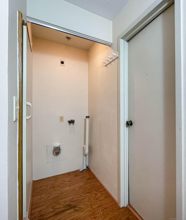 111 Dekoven Dr Apt 506, Middletown, CT 06457 - laundry area featuring hookup for an electric dryer and wood finished floors