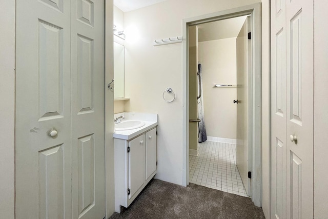 111 Dekoven Dr Apt 506, Middletown, CT 06457 - bathroom featuring vanity, tile patterned floors, and a closet
