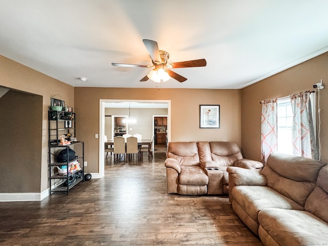153 Prospect St, Plainfield, CT 06354 - living area with dark wood-type flooring, ceiling fan, and baseboards