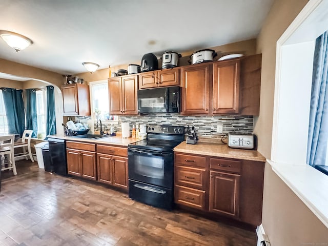 153 Prospect St, Plainfield, CT 06354 - kitchen with black appliances, a sink, decorative backsplash, and light countertops