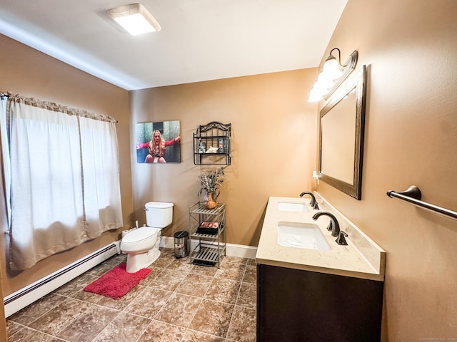 153 Prospect St, Plainfield, CT 06354 - bathroom with a baseboard radiator, toilet, double vanity, and tile patterned floors
