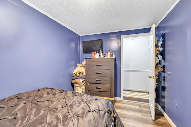 66 Coleman St, West Haven, CT 06516 - bedroom with a textured ceiling, crown molding, wood finished floors, and baseboards