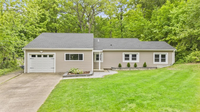 179 Carey Ave, Meriden, CT 06451 - view of front facade featuring concrete driveway, a garage, a front yard, and a shingled roof