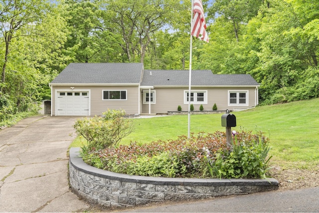179 Carey Ave, Meriden, CT 06451 - single story home featuring concrete driveway, a garage, and a front lawn