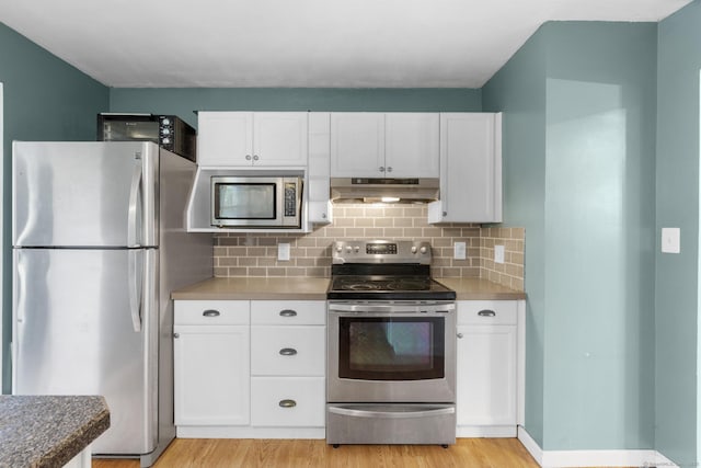 179 Carey Ave, Meriden, CT 06451 - kitchen featuring appliances with stainless steel finishes, under cabinet range hood, white cabinets, and tasteful backsplash