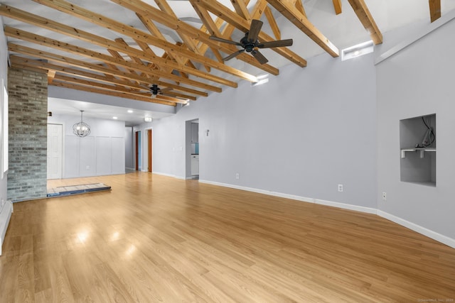 179 Carey Ave, Meriden, CT 06451 - unfurnished living room featuring ceiling fan, high vaulted ceiling, beamed ceiling, light wood finished floors, and a chandelier