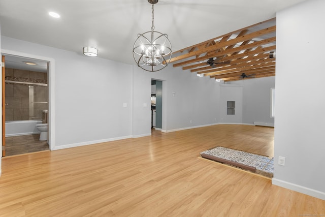 179 Carey Ave, Meriden, CT 06451 - unfurnished living room with a ceiling fan, a chandelier, wood finished floors, and baseboards