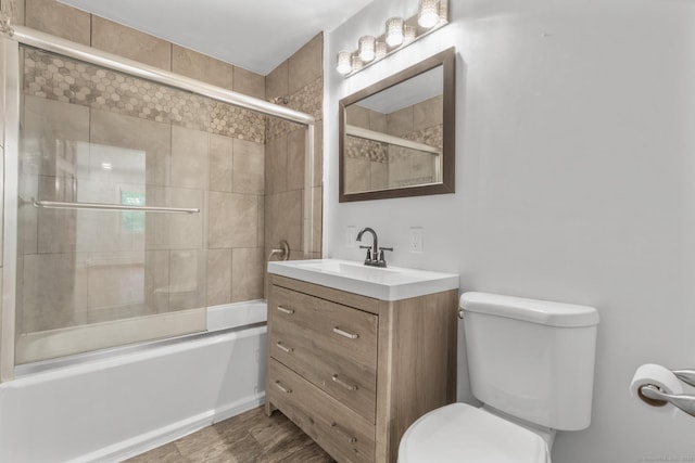 179 Carey Ave, Meriden, CT 06451 - full bathroom featuring toilet, enclosed tub / shower combo, vanity, and wood finished floors