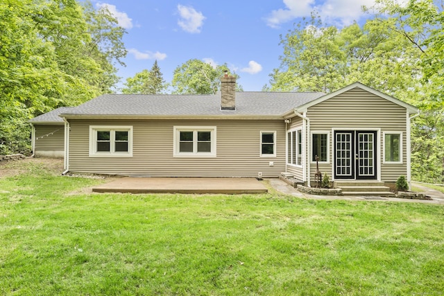 179 Carey Ave, Meriden, CT 06451 - back of house with a chimney, a yard, a patio, and french doors