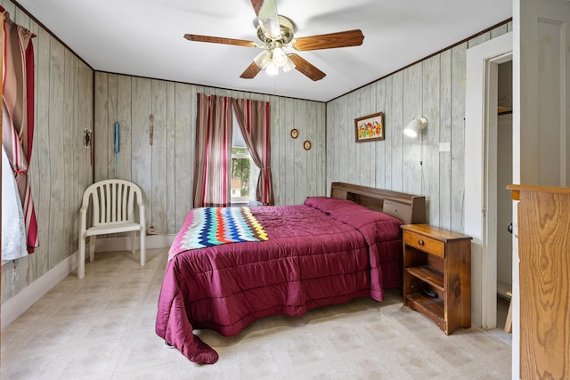 48 Burlington Ave, Bristol, CT 06010 - bedroom with tile patterned floors, wood walls, and a ceiling fan