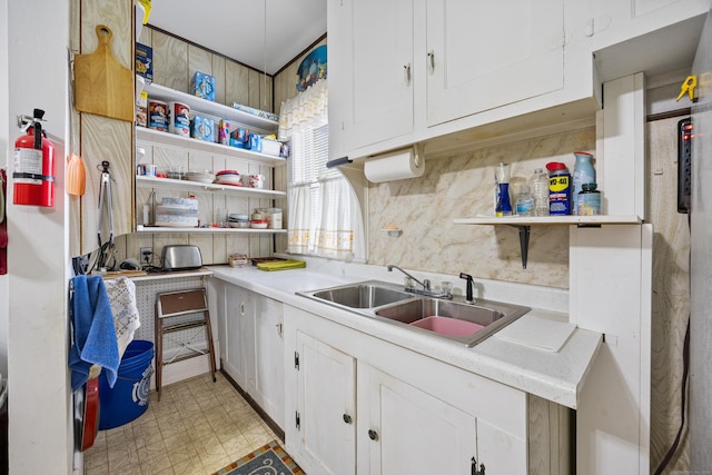 48 Burlington Ave, Bristol, CT 06010 - kitchen featuring open shelves, a sink, white cabinets, and decorative backsplash