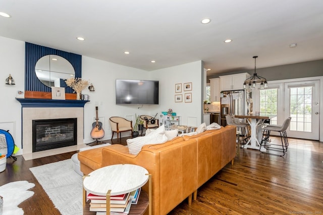 50 Almira Dr Unit B, Greenwich, CT 06831 - living room featuring wood finished floors, a tiled fireplace, recessed lighting, and a chandelier