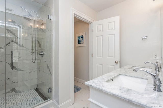 50 Almira Dr Unit B, Greenwich, CT 06831 - bathroom featuring marble finish floors, a marble finish shower, baseboards, and double vanity