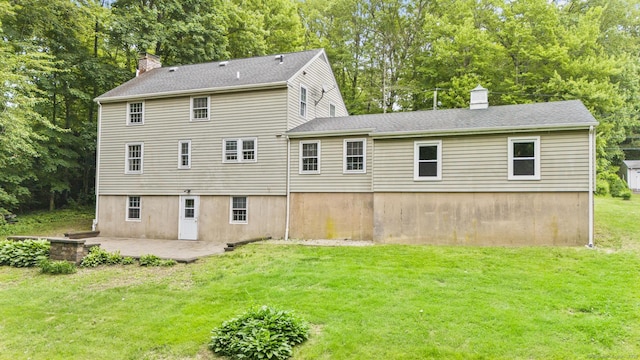 5 Brainerd Dr, Portland, CT 06480 - back of property featuring a chimney, a patio, a yard, and roof with shingles