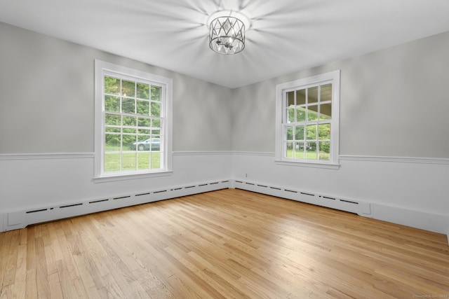 5 Brainerd Dr, Portland, CT 06480 - unfurnished room featuring plenty of natural light, wood-type flooring, and a chandelier