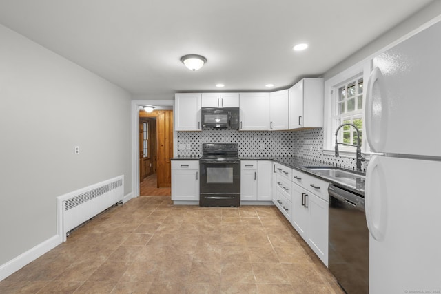5 Brainerd Dr, Portland, CT 06480 - kitchen with black appliances, radiator heating unit, a sink, dark countertops, and decorative backsplash