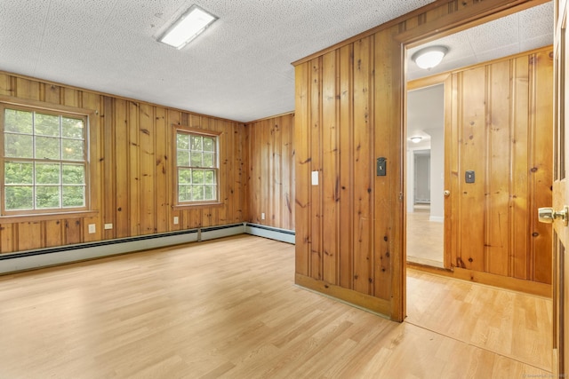 5 Brainerd Dr, Portland, CT 06480 - spare room with wood finished floors, baseboard heating, and wooden walls