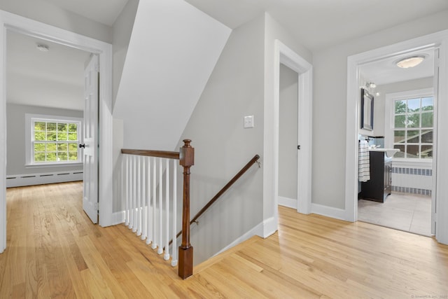 5 Brainerd Dr, Portland, CT 06480 - hallway with an upstairs landing, radiator, a baseboard radiator, and light wood-style floors