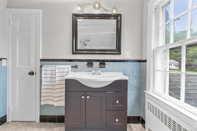 5 Brainerd Dr, Portland, CT 06480 - bathroom featuring radiator, tile walls, vanity, and a wainscoted wall