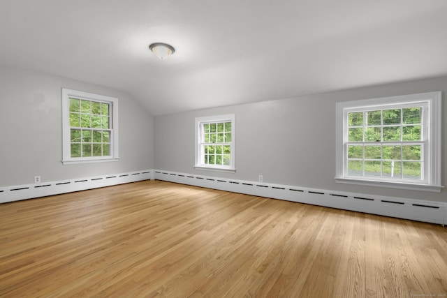 5 Brainerd Dr, Portland, CT 06480 - bonus room with light wood-style flooring, vaulted ceiling, and a baseboard heating unit