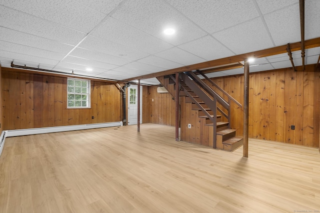 5 Brainerd Dr, Portland, CT 06480 - basement with wood finished floors, stairway, wooden walls, a drop ceiling, and a baseboard radiator