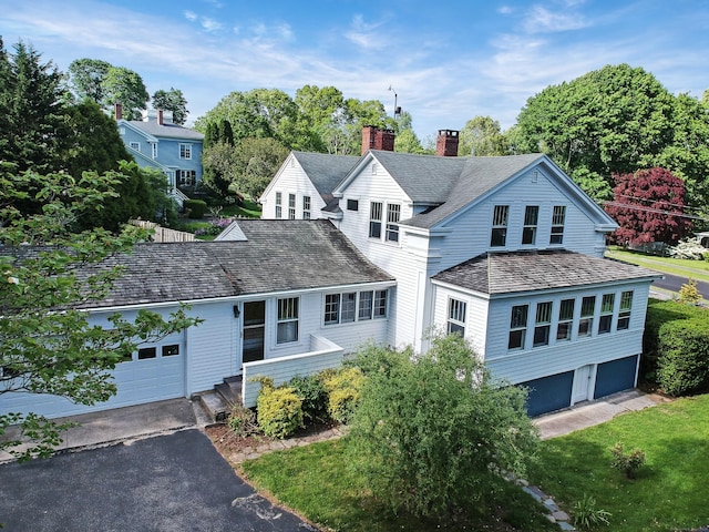 14 W Mystic Ave, Groton, CT 06355 - traditional home with a chimney, a garage, and driveway