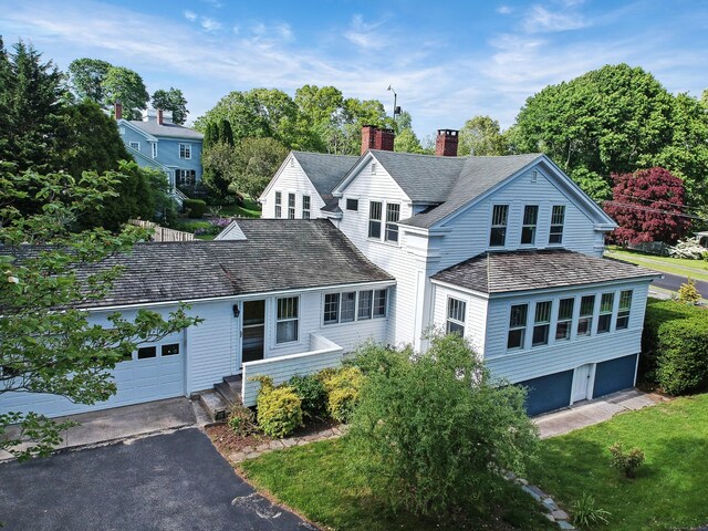 14 W Mystic Ave, Groton, CT 06355 - traditional-style house with a chimney, a garage, and asphalt driveway