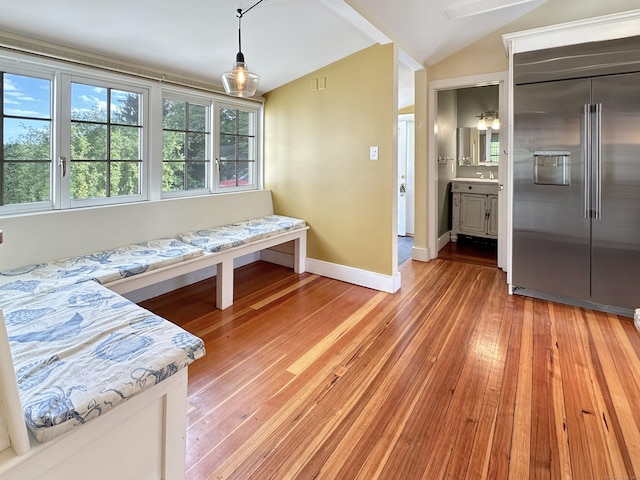 14 W Mystic Ave, Groton, CT 06355 - dining space with lofted ceiling, light wood finished floors, and baseboards